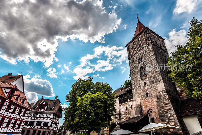 Low Angle View Of Tiergärtnertorturm And Albrecht Durer House In Nuremberg, Germany